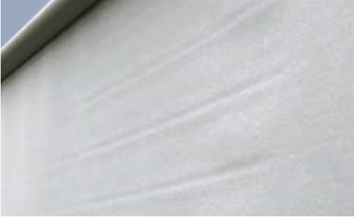 Close-up of a light grey fabric, possibly a awning fabric, displaying smooth textures and subtle folds.