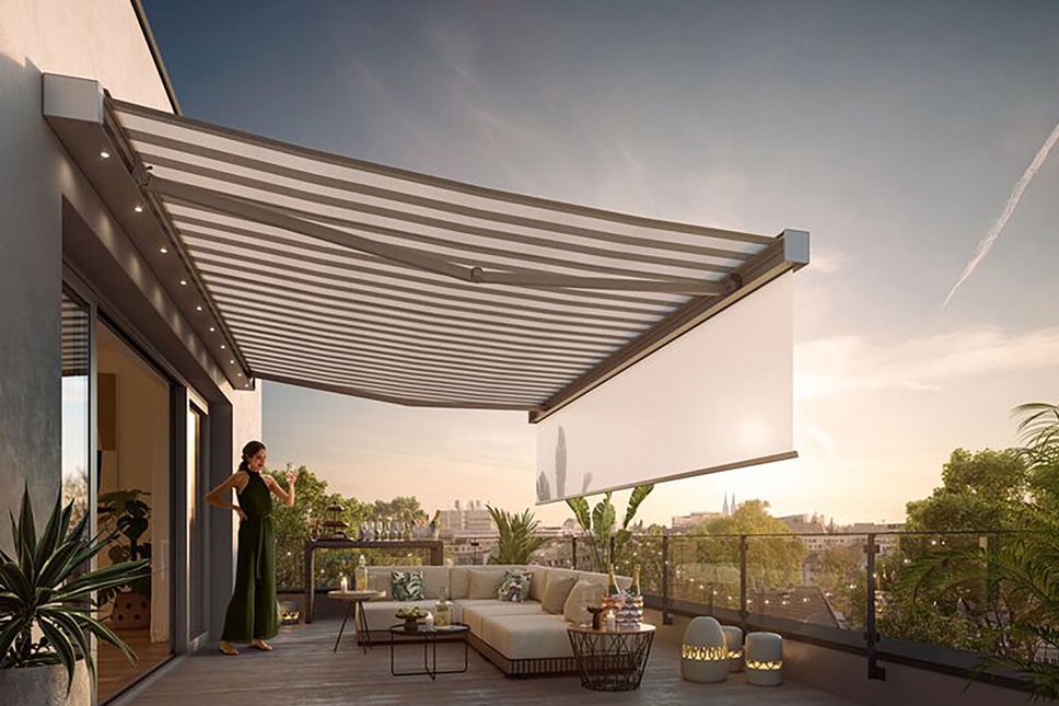 A spacious terrace with a large awning casting shadows, greenery in planters, and a comfortable seating area. A spacious terrace with a large awning casting shadows, greenery in planters, and a comfortable seating area.