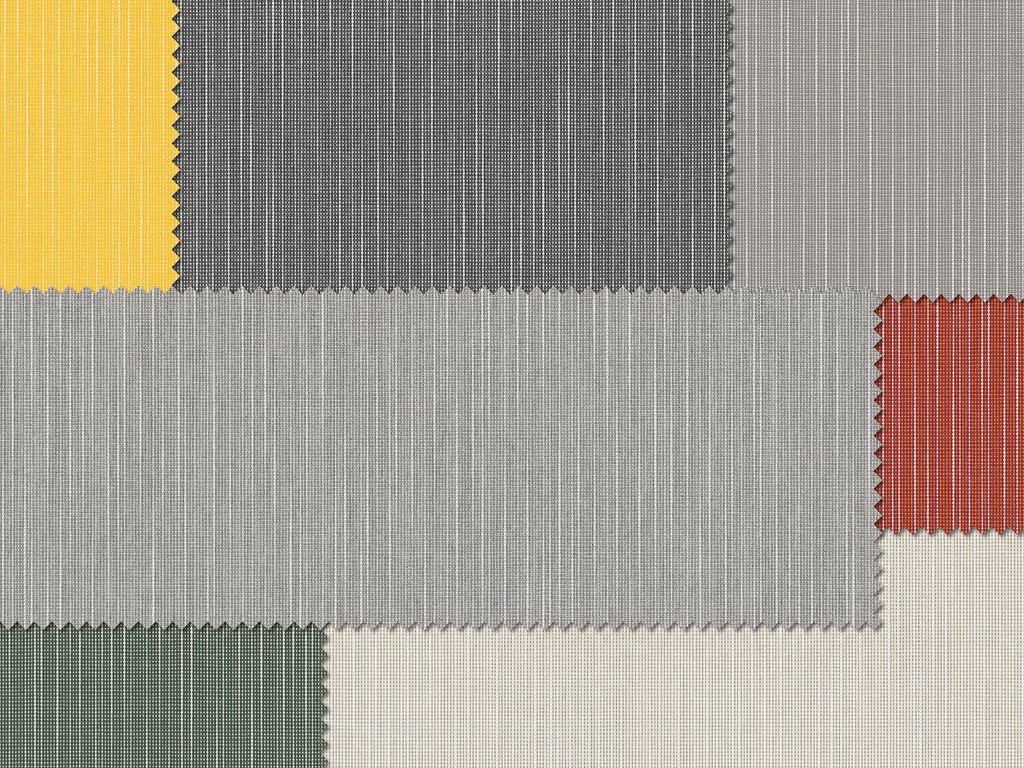 A textured fabric sampling with blocks of yellow, grey, black, green, and red colours.