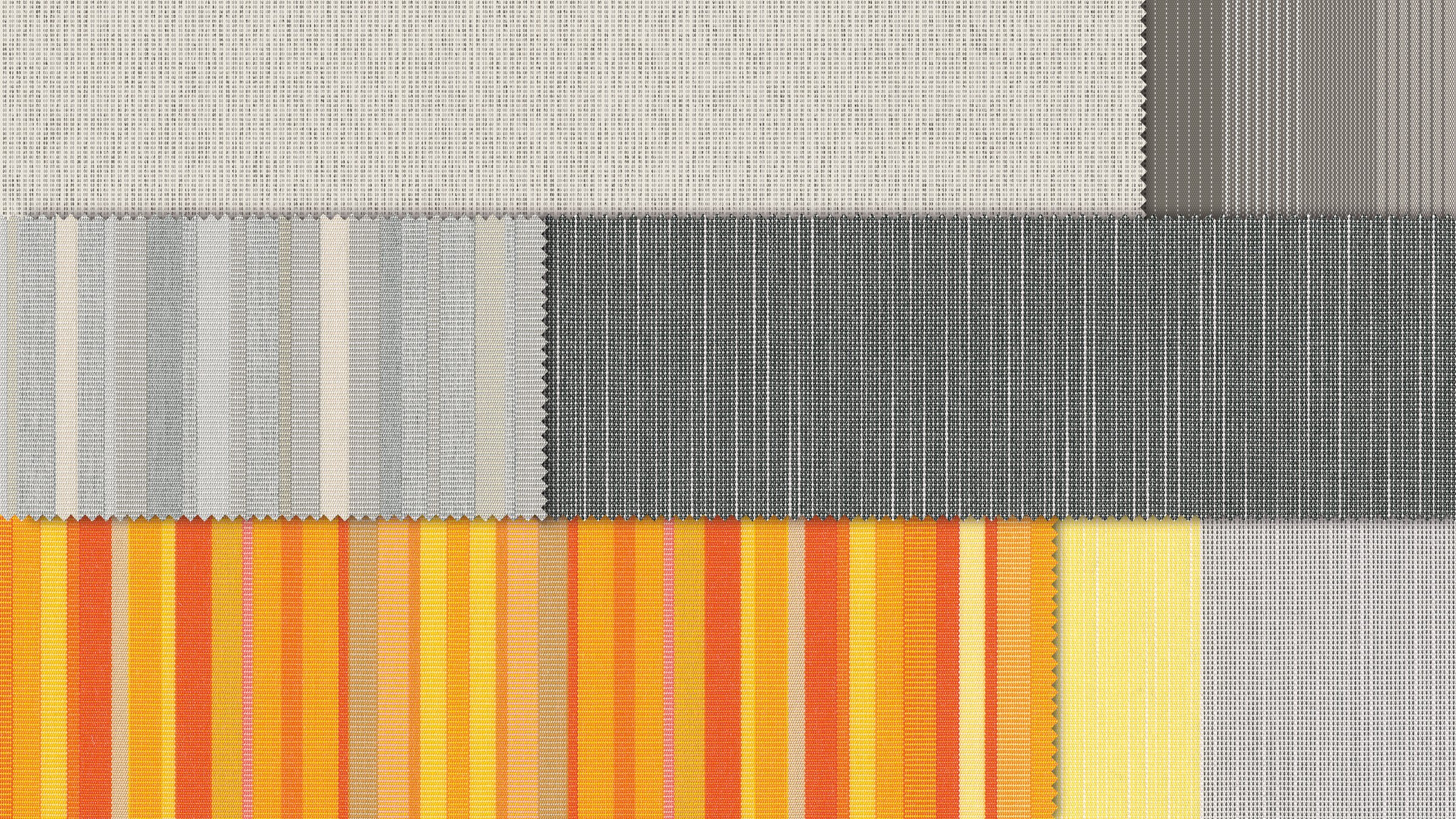 A collection of rolled fabrics in various colours and patterns, featuring stripes and blocks.