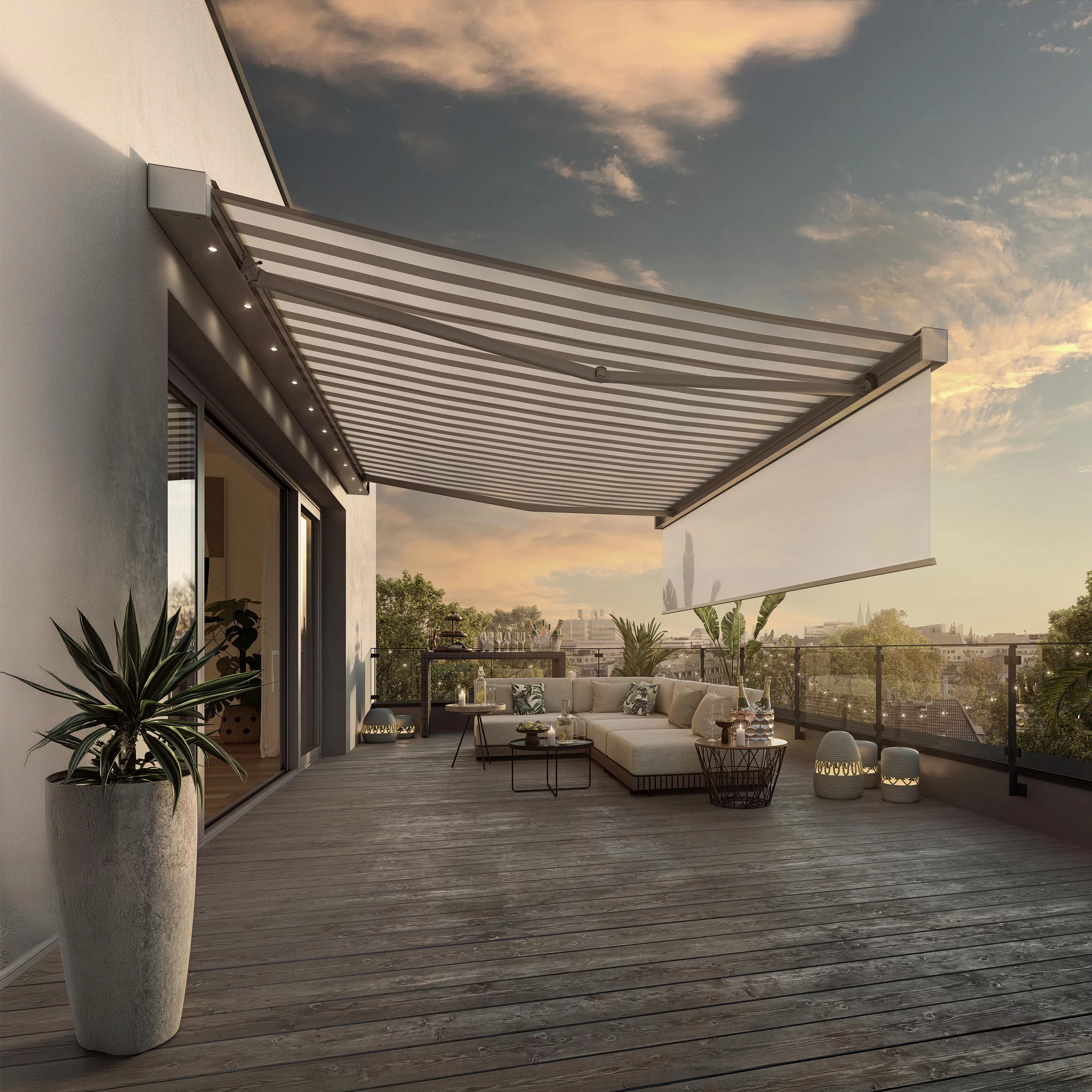 A sun awning with a striped design extends over a terrace with seating and plants, under a blue sky.