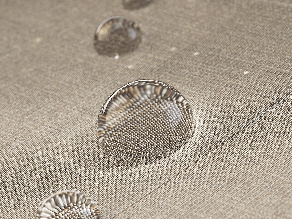 Water droplets on a textured, beige surface. Water droplets on a textured, beige surface.