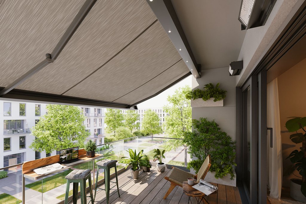 A balcony featuring a large awning, wooden flooring, and potted plants under a clear sky.