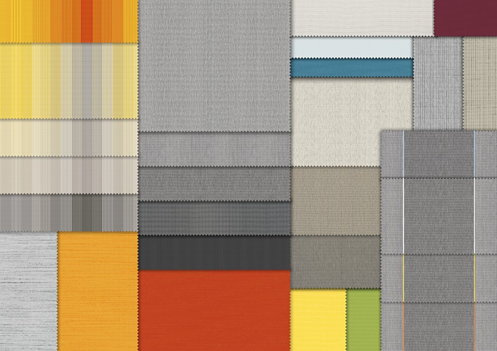 A patchwork of various fabric swatches in bright and neutral tones arranged in a grid pattern. A patchwork of various fabric swatches in bright and neutral tones arranged in a grid pattern.