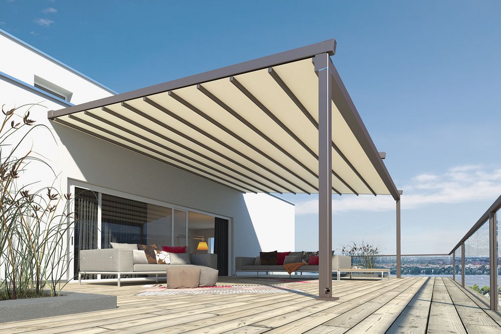 A modern overhang with a sloped roof providing shade over a wooden terrace area.
