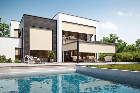 Modern house with a pool, featuring terrace awnings and greenery in the background under a blue sky. Modern house with a pool, featuring terrace awnings and greenery in the background under a blue sky.