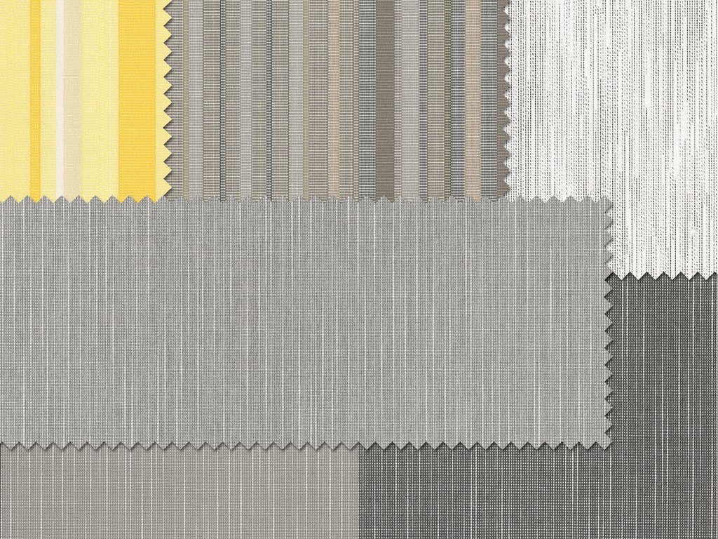 Textiles in various patterns and shades of grey with yellow accents. Textiles in various patterns and shades of grey with yellow accents.