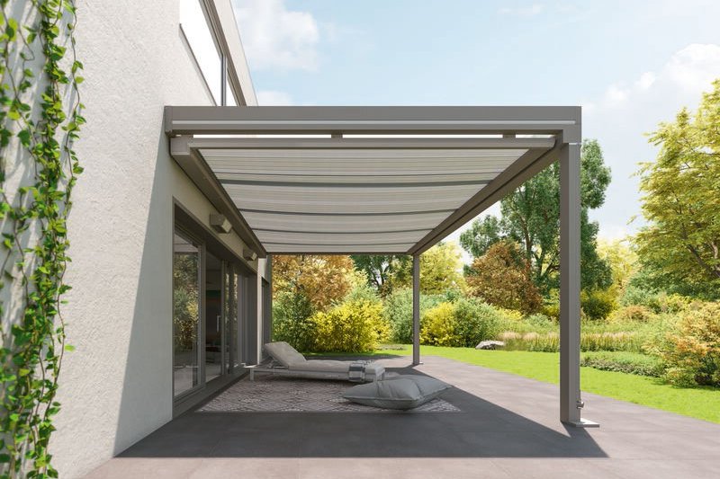 A modern overhanging structure with a transparent roof in a green garden setting. A modern overhanging structure with a transparent roof in a green garden setting.