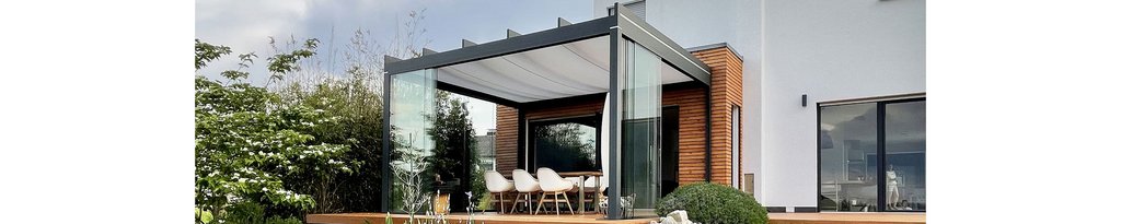 A modern overhanging structure with glass walls and a fabric roof, surrounded by greenery. A modern overhanging structure with glass walls and a fabric roof, surrounded by greenery.