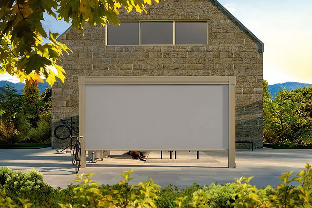 A modern building with a flat-roofed extension, featuring a white panel and surrounded by greenery. A modern building with a flat-roofed extension, featuring a white panel and surrounded by greenery.