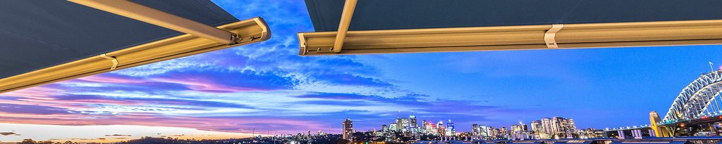 Skyline view with vibrant sunset colours and a awning box framing the scene.