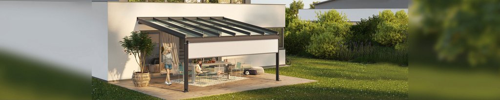 A modern glass-roofed structure with a sleek design, set in a lush green garden area.