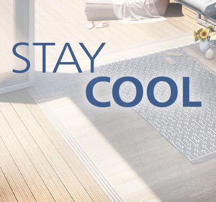 Light wooden flooring with a textured grey rug and text overlay.