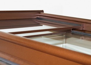 Close-up of a brown frame with glass panels, showcasing a modern design element. 