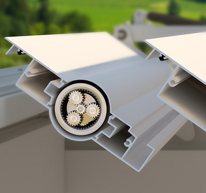 Cutaway view of a mechanism inside a awning box, showing gears and a white exterior.
