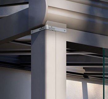 Detail of a modern structure featuring a vertical support column and sleek lines, predominantly in light grey.