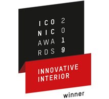 Award logo featuring a combination of black and red with text indicating winner of an innovative interior award.