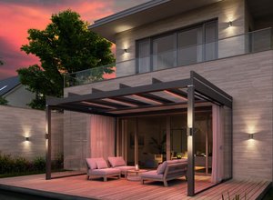A modern terrace covered by an overhanging structure, featuring seating and outdoor lighting at dusk.