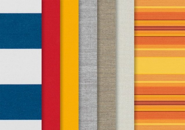 A collection of fabric swatches in various colours, including blue, red, yellow, grey, and orange stripes.
